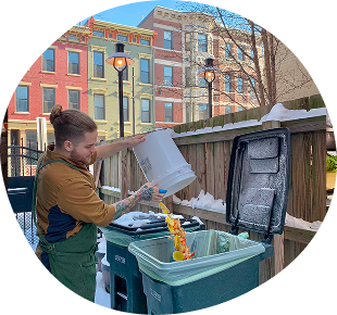 Commercial Queen City commons users dumping compost into bin